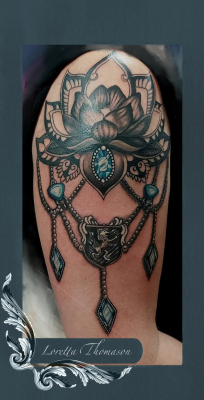 Loretta Thomason gem tattoo
